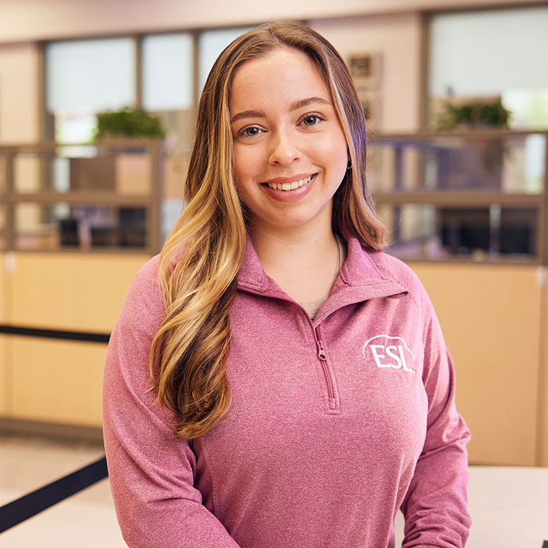 ESL employee smiling in an branch lobby